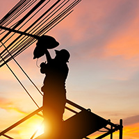 A man on a lift repairing a streetlight