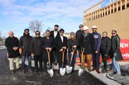 An image of a groundbreaking ceremony with developers and members of Town Council for a new commercial development in Essex Centre