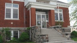 Red brick building with wide staircase