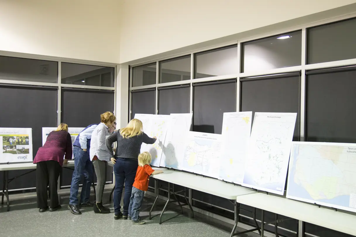 people looking at maps on easels