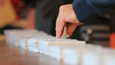 hand sorting papers.