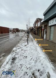 Downtown Essex sidewalk depicting where snow should be shoveled.